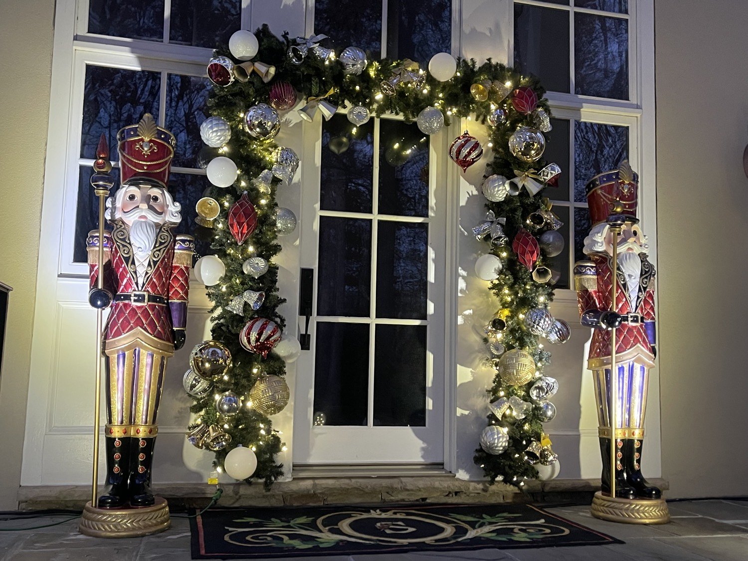 Residential door arch with ornaments and two nutcrackers